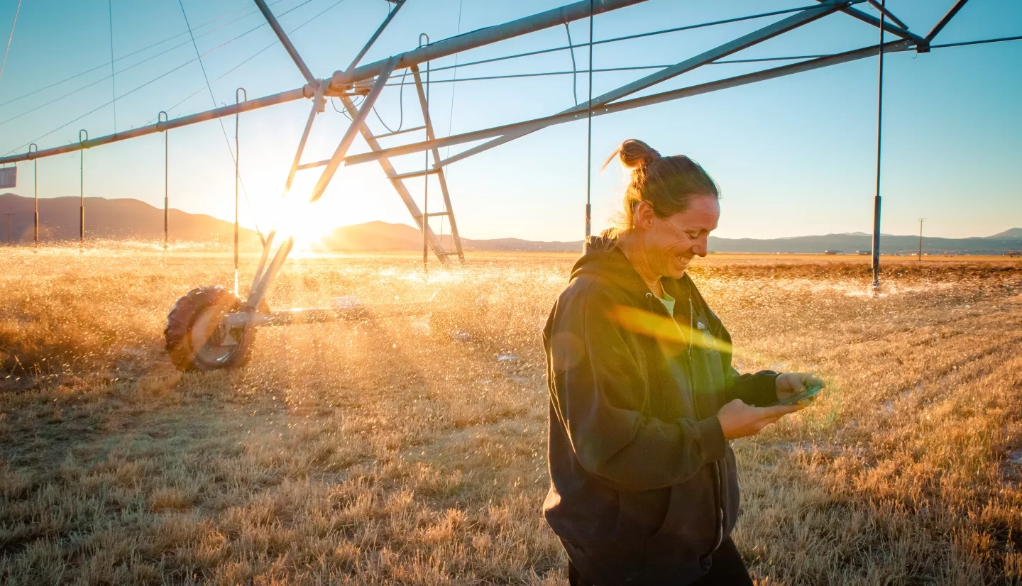 Photo of Nevada Denise Moyle in her alfalfa field