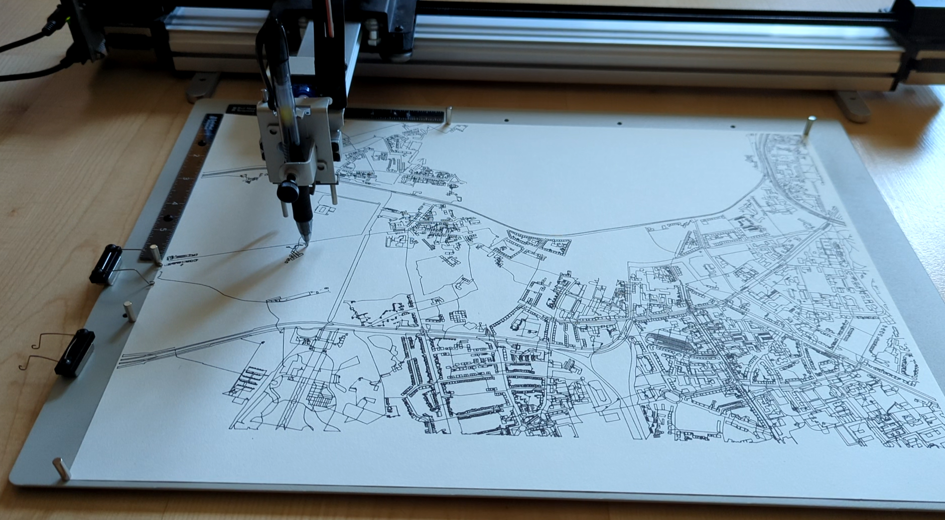 Image of a plotter plotting a map