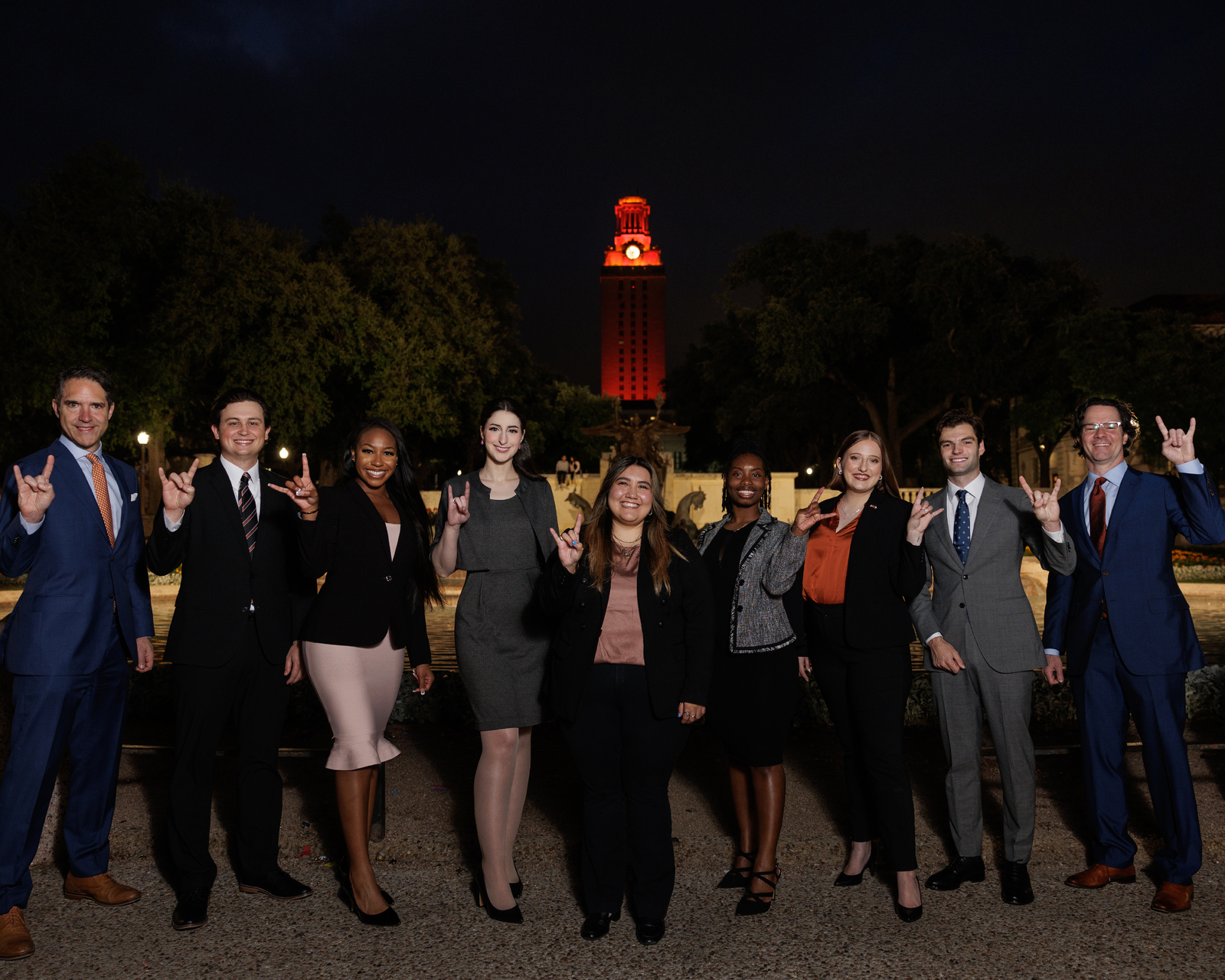 Students and faculty in front of the UT Tower celebrating a mock trial championship