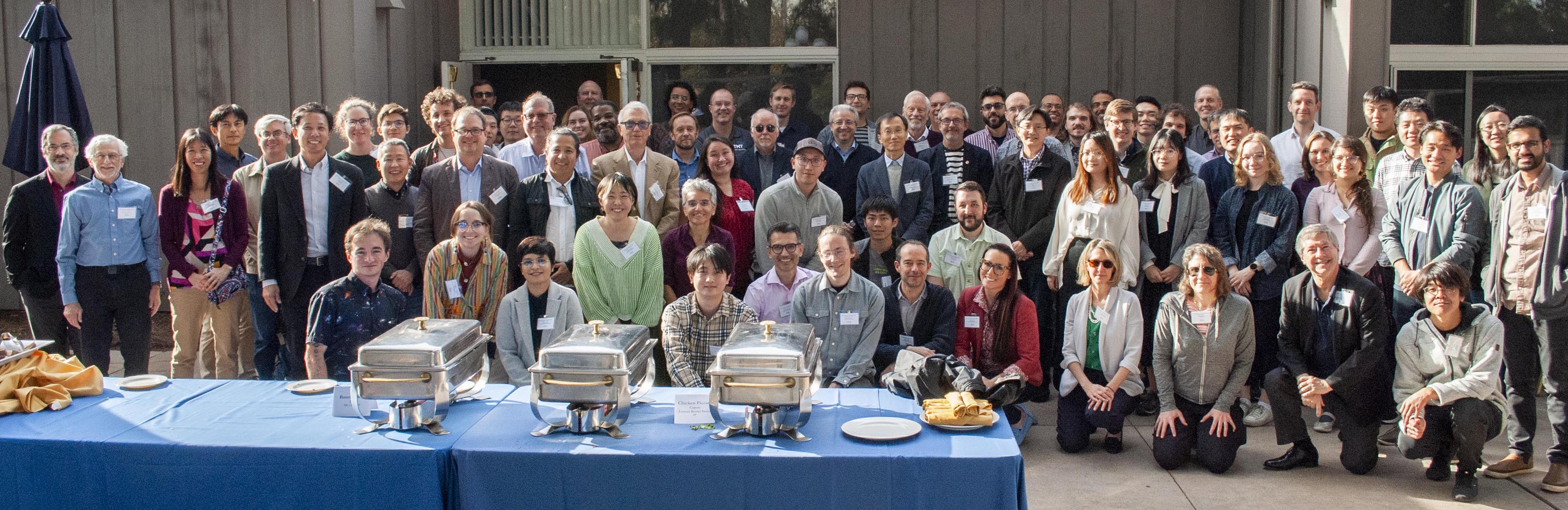 Group picture of the participants on the patio outside of the conference room.