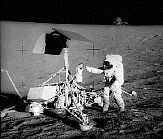 Image of Apollo 12 astronaut Pete Conrad standing next to Surveyor 3