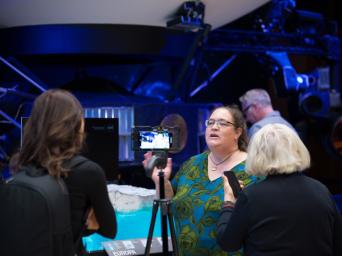 Europa Clipper Science Communications Lead Cynthia Phillips explains the science of the mission to members of the media in von Kármán Auditorium at the agency's Jet Propulsion Laboratory on April 11.