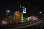 The main body of NASA's Europa Clipper spacecraft is seen in its shipping container as it rolls into the agency's Jet Propulsion Laboratory in Southern California.