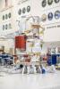 Engineers and technicians work together to install reaction wheels on the underside of the main body of NASA's Europa Clipper spacecraft, which is in its assembly, test, and launch operations phase.