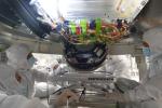 Engineers install a 2-foot-wide reaction wheel onto the main body of NASA's Europa Clipper spacecraft at the agency's Jet Propulsion Laboratory in Southern California.