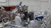 Engineers and technicians are seen closing the vault of NASA's Europa Clipper in the main clean room of the Spacecraft Assembly Facility at JPL on Oct. 7, 2023. The vault will protect the electronics of the spacecraft as it orbits Jupiter.