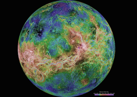 A false color photo of Venus that uses blues, greens, yellows, and reds to show differences in the surface such as craters and mountains.