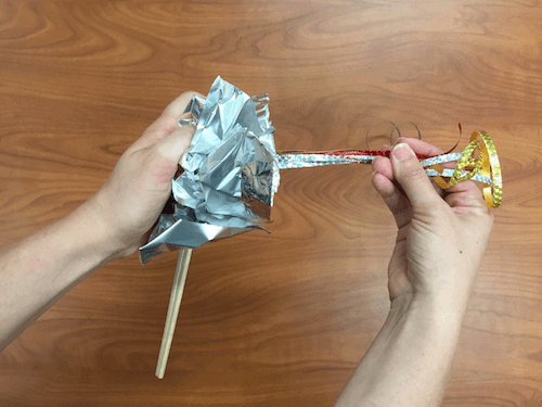 the foil is being compressed into a round shape