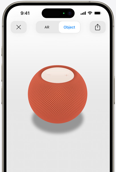 Orange HomePod on the screen of an iPhone in AR view.