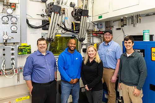 Team members at ORNL's Radiochemical Engineering Development Center