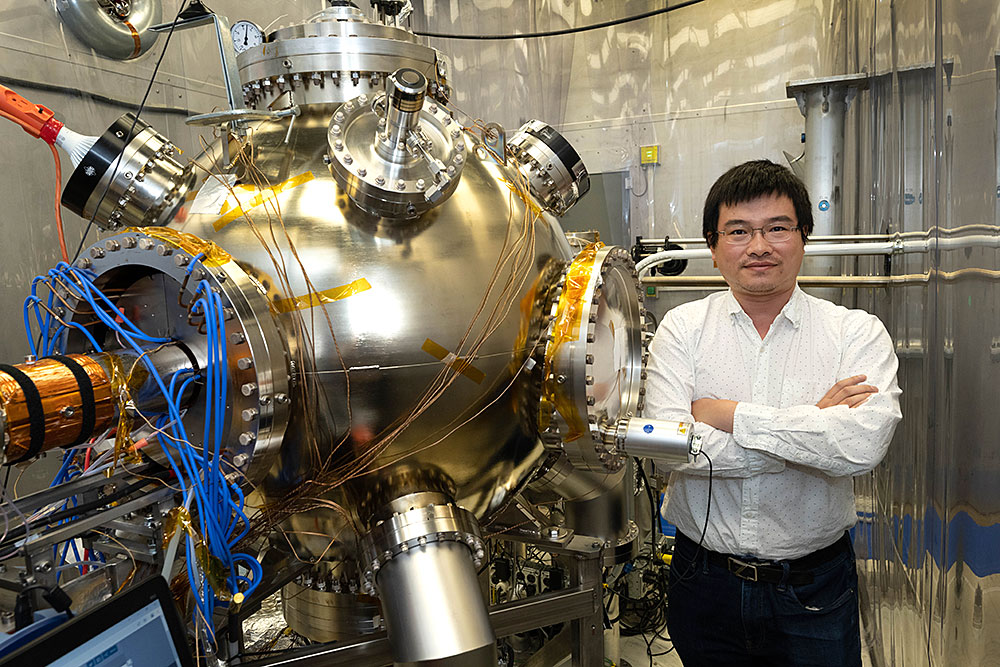 Erdong Wang with the high-voltage polarized electron gun