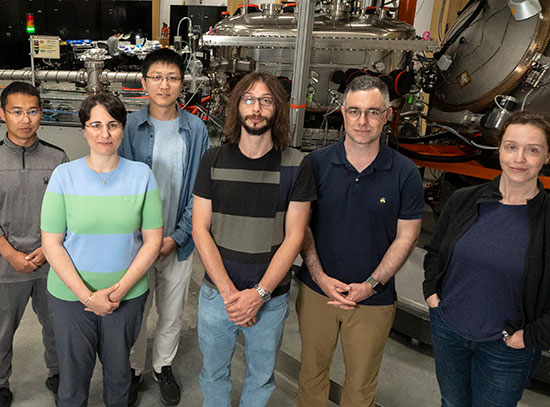 Researchers pose as a group with the SIX beamline