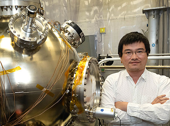 Erdong Wang with the high-voltage polarized electron gun