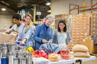 three women one man at a food bank