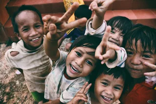 Happy children peace signs