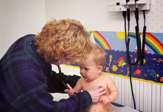 doctor listening to baby's heart