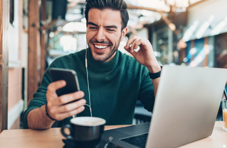 man looking at graphs on tablet