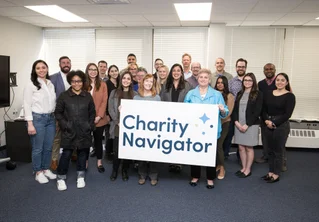 Charity Navigator staff with logo