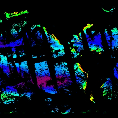 This is an image showing simulated chlorophyll concentrations in the ocean on March 21, 2022. The image has a black background. Regions colored in blue represent areas of low chlorophyll concentration, green are medium, and red areas have high levels. The image has strips of black running through the colored areas from the upper left to the lower right to show PACE’s orbital track around the globe and places across the ocean where it has not scanned.