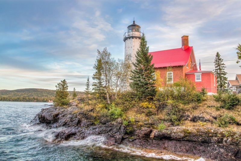 Lighthouse next to the water.