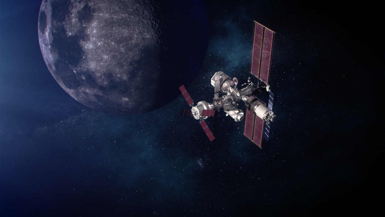 An artist's depiction of Gateway, the Moon-orbiting space station. Gateway is seen in gray with red solar arrays; behind it, the Moon is gray, black, and white, as well as the blackness of space. Credit: NASA/Alberto Bertolin