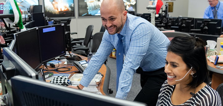 Expedition 61 Flight Directors Marcos Flores and Pooja Jesrani along with their team of flight controllers monitor operations on the International Space Station on Dec. 24, 2019. Credits: NASA/Robert Markowitz