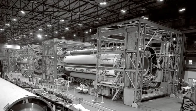 In January 1961, engineers at NASA’s Marshall Space Flight Center prepared the massive first stage of the Saturn I rocket for checkout. The booster was designed with eight clustered H-1 engines capable of producing as much as 1.5 million pounds of thrust. Credit: NASA