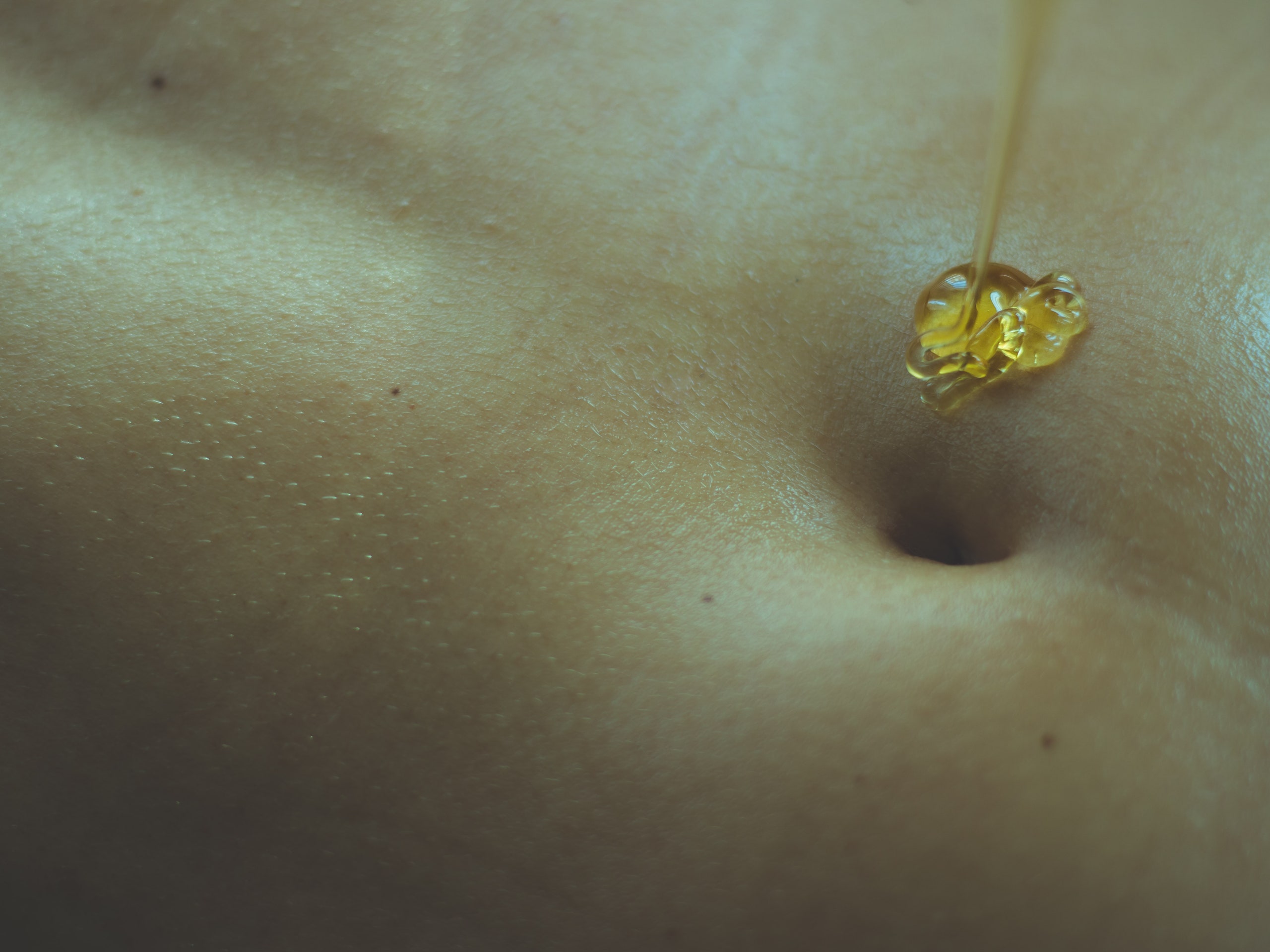 I Tried Navel Oiling For a Month&-Here's How It Went