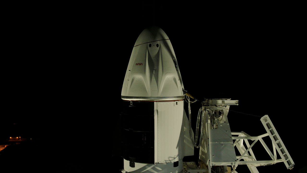 A SpaceX Falcon 9 rocket with the company’s Dragon spacecraft on top is seen on the launch pad at Launch Complex 39A at Kennedy Space Center. 