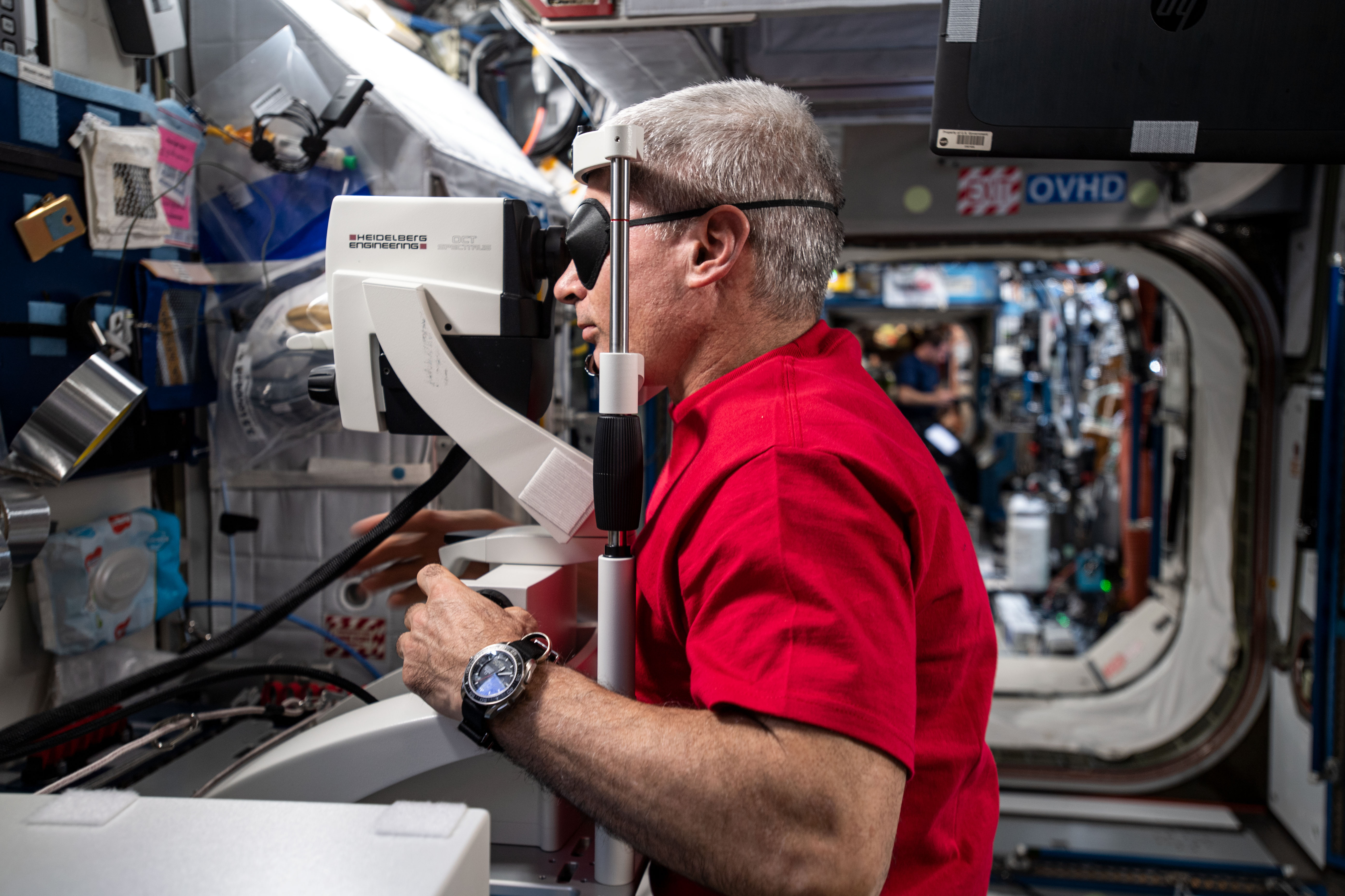 NASA astronaut Mark Vande Hei gets his eyes checked aboard the International Space Station in May 2021.