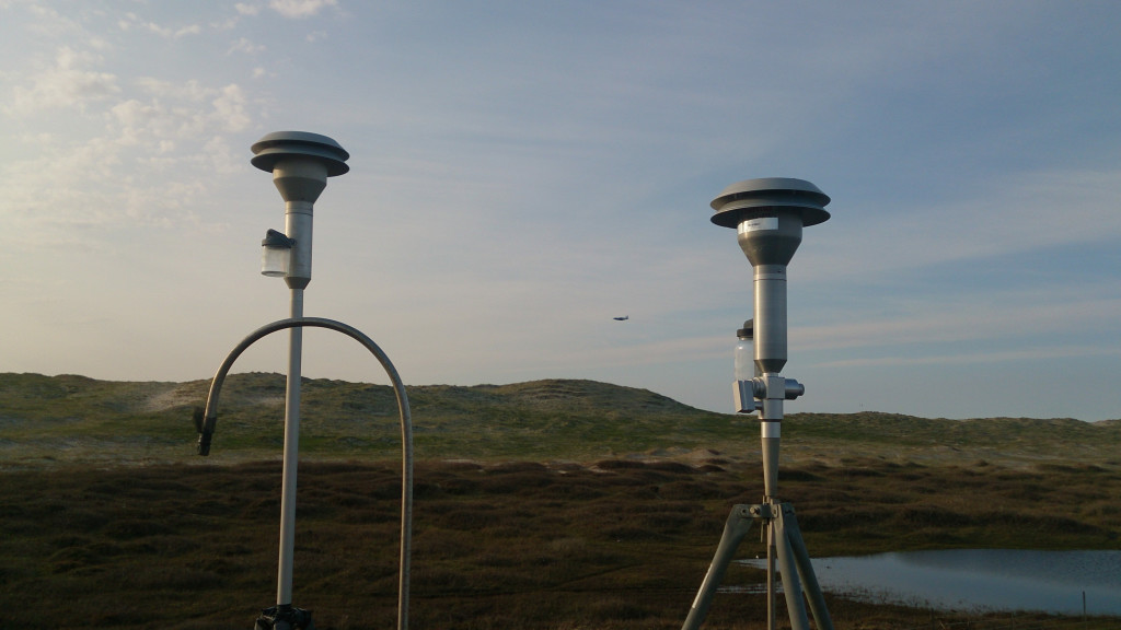 From the ground site on Sable Island, the C-130 can be seen passing over in the upper distance. Credit: NASA/Codey Barnett