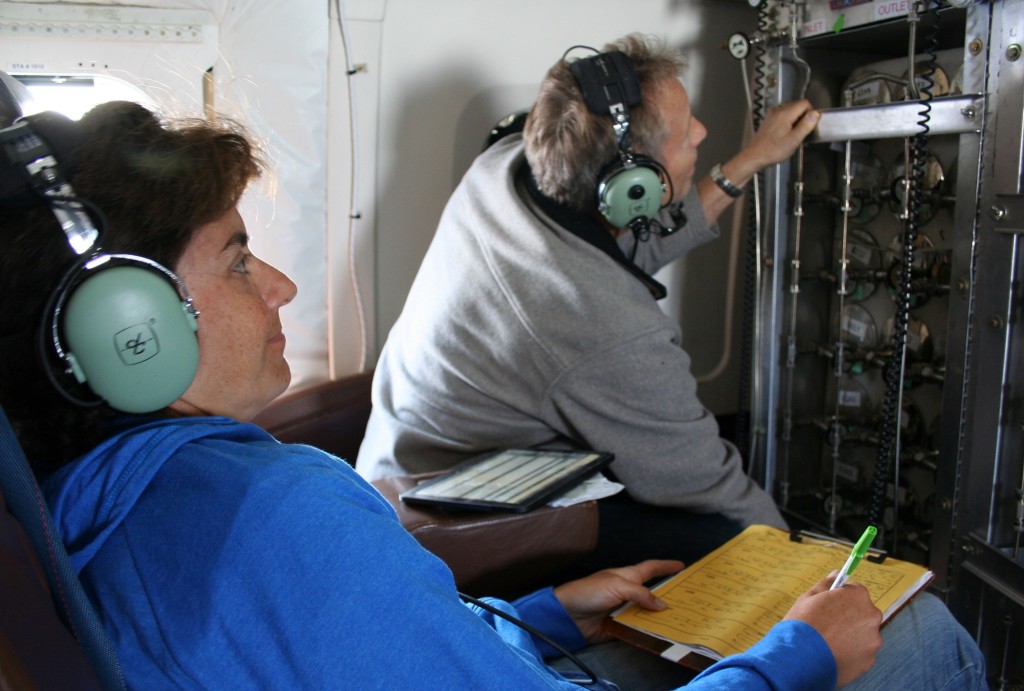 Donald Blake and Barbara Barletta, atmospheric scientists at the University of California, Irvine, spend much of the flight filling cans with air samples for later analysis. Credit: NASA/Samson Reiny