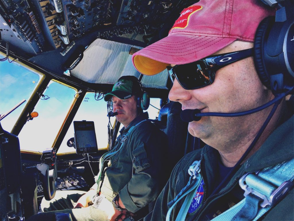 Pilots Brian Bernth, foreground, and Jeff Callaghan maneuver the C-130 to altitudes from 1,000 to 25,000 feet. Twice during the 5-hour flight, they push the aircraft into long, looping spirals that start high and end with turbulent low-altitude runs. Credit: NASA/Joe Atkinson