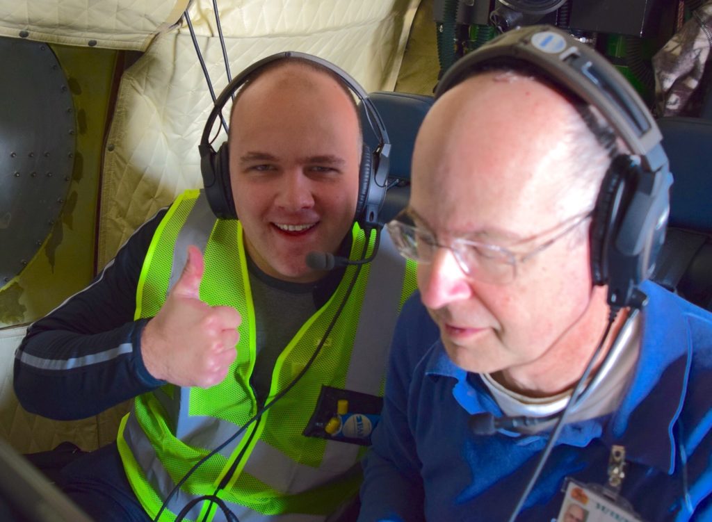 Andrew Dzambo from the University of Wisconsin (left) and Steve Durden from NASA’s Jet Propulsion laboratory monitor the Airborne Precipitation Radar which measures cloud droplet size aboard the P-3. Credit: NASA/Jane Peterson