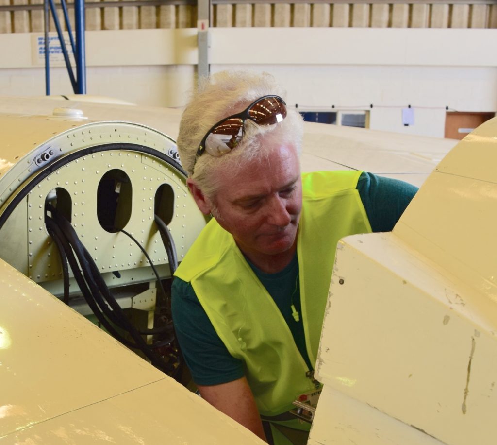 Brian Cairns of Goddard’s Institute for Space Studies works on the Aerosol Polarimetry Sensor in the pod under the ER-2 wing. Credit: NASA/Jane Peterson