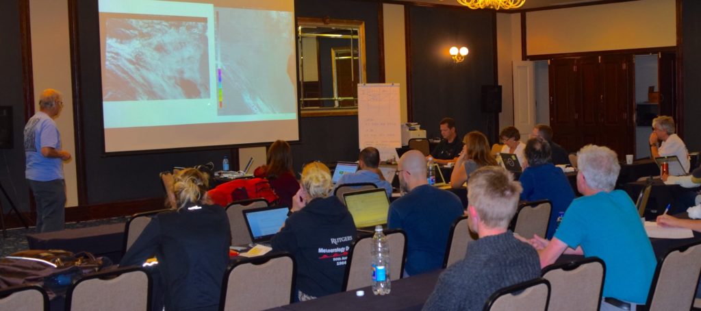 Mission Operations is set up in a conference room at the Swakomund Hotel in Swakomund, about a 45-minute drive from the Walvis Bay Airport and the NASA research planes. The weather forecast briefing is the highlight of every day. Credit: NASA/Jane Peterson