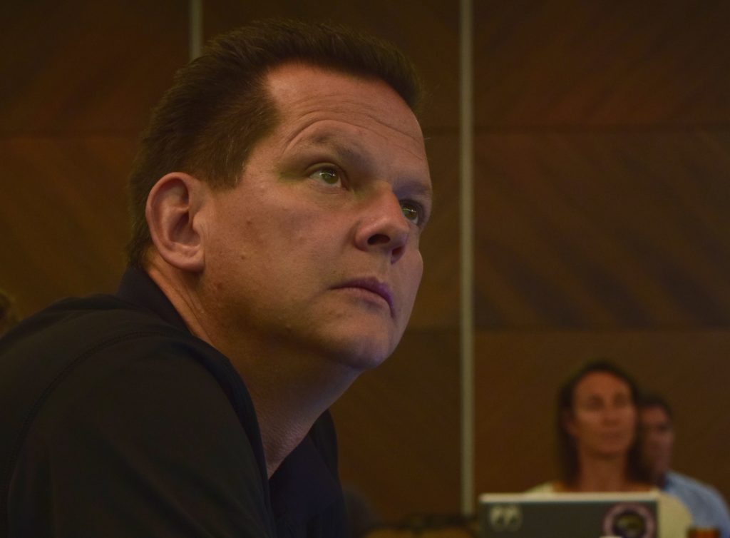 ORACLES principal investigator Jens Redemann listens intently to the forecast briefing that will be used for flight planning. Credit: NASA/Jane Peterson