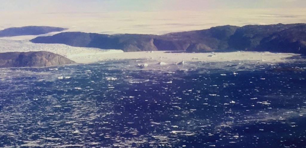 Loosely packed sea ice in front of Store Glacier. Credit: NASA/JPL-Caltech