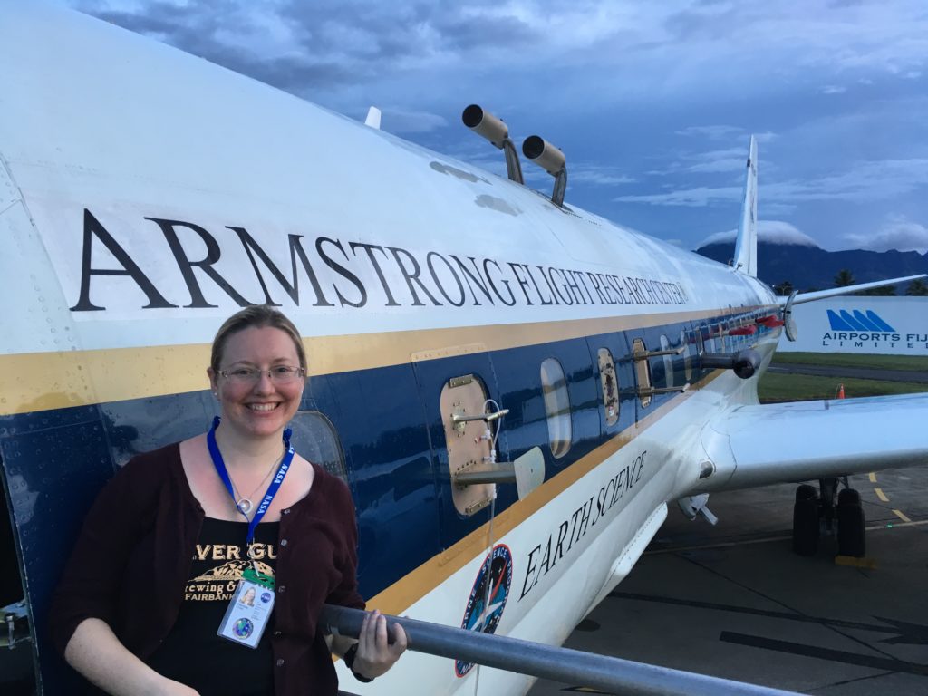 Atmospheric chemist Róisín Commane on the stairs of DC-8. Air intake valves stubble the outside of the plane to draw air into the instruments while in flight. Nadi, Fiji, Feb 6 2017. Credit: NASA