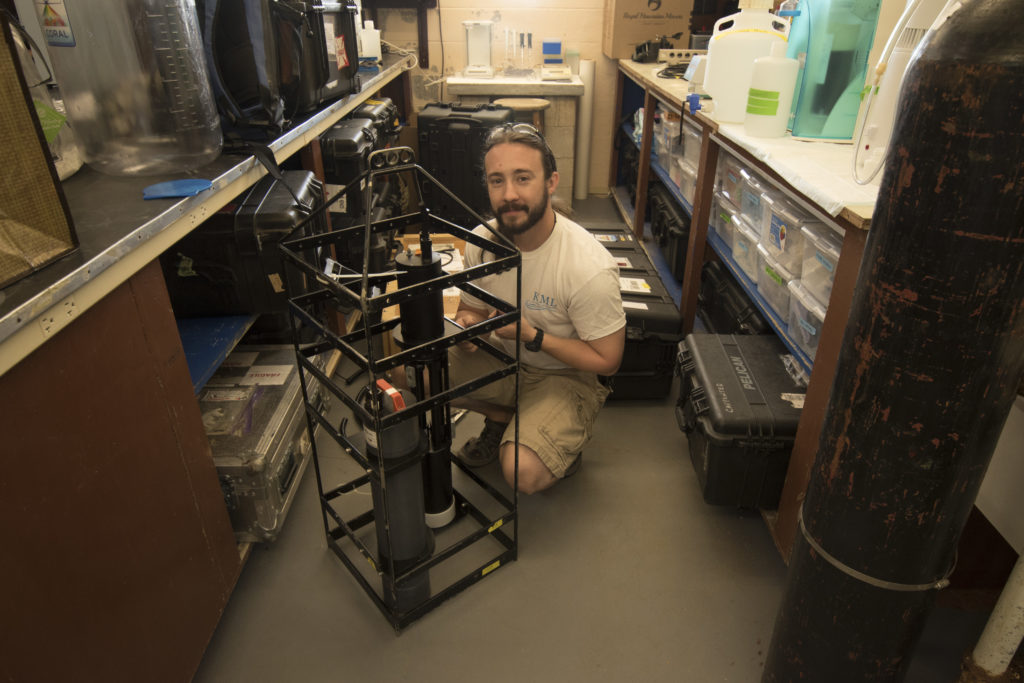 Brandon Russell (UCONN) checks instrumentation before a field deployment. Credit: BIOS/Stacy Peltier