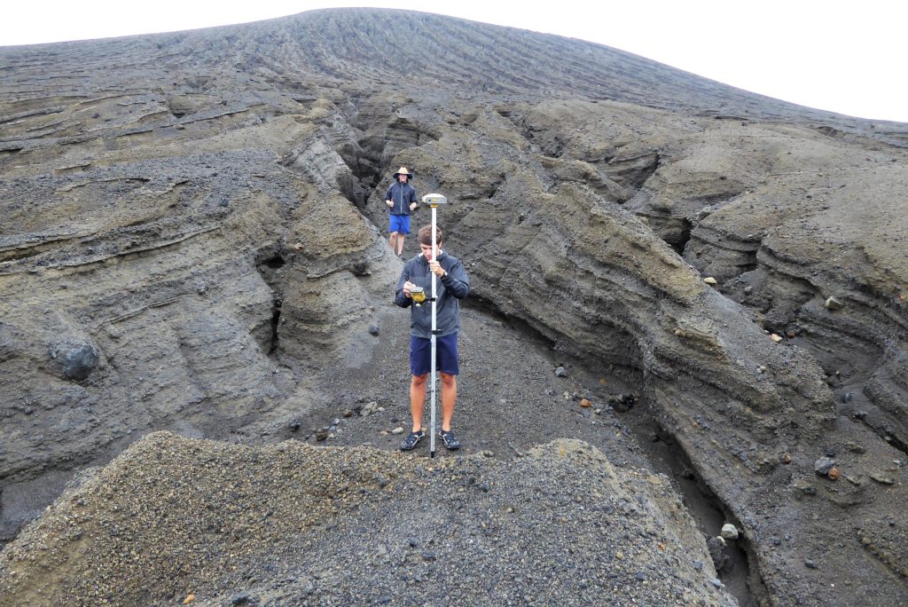 A SEA student takes a GPS point in one of the gullies. Credit: Dan Slayback