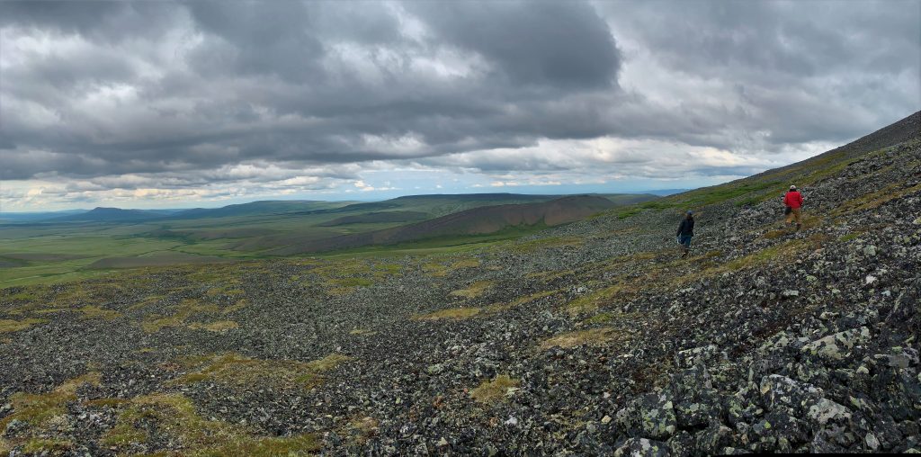 Katie Orndahl (left) and Rachel Pernick (right) scaling rocky slopes in search of caribou near the Yukon/Northwest Territory border. Photo credit to Aerin Jacob