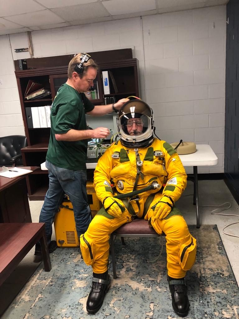 Three hours before takeoff at Hunter Army Air Field in Savannah, Georgia, ER-2 pilot Cory Bartholomew was helped into his full-pressure suit and breathed pure oxygen to help remove nitrogen from his bloodstream. This process prevents decompression sickness at high-altitudes. Credit: NASA/Katie Stern