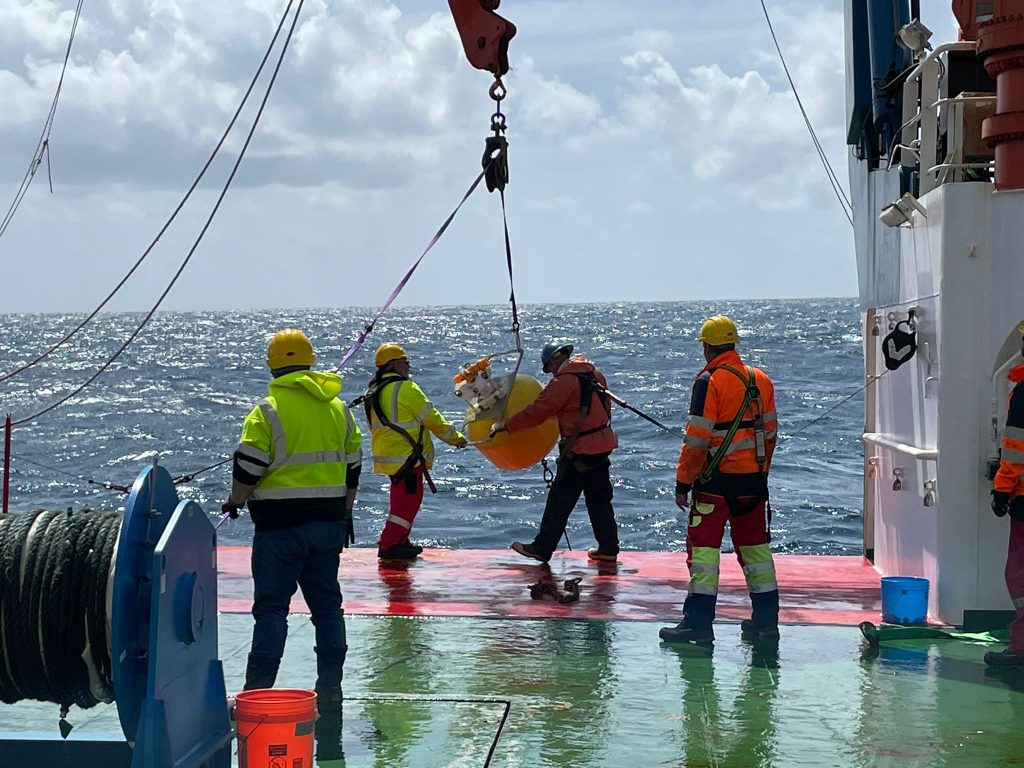 Deployment of the Wire Walker, an instrument that sampled up and down the water column while drifting with the currents and generating its power by waves.  Credit: Deborah Steinberg