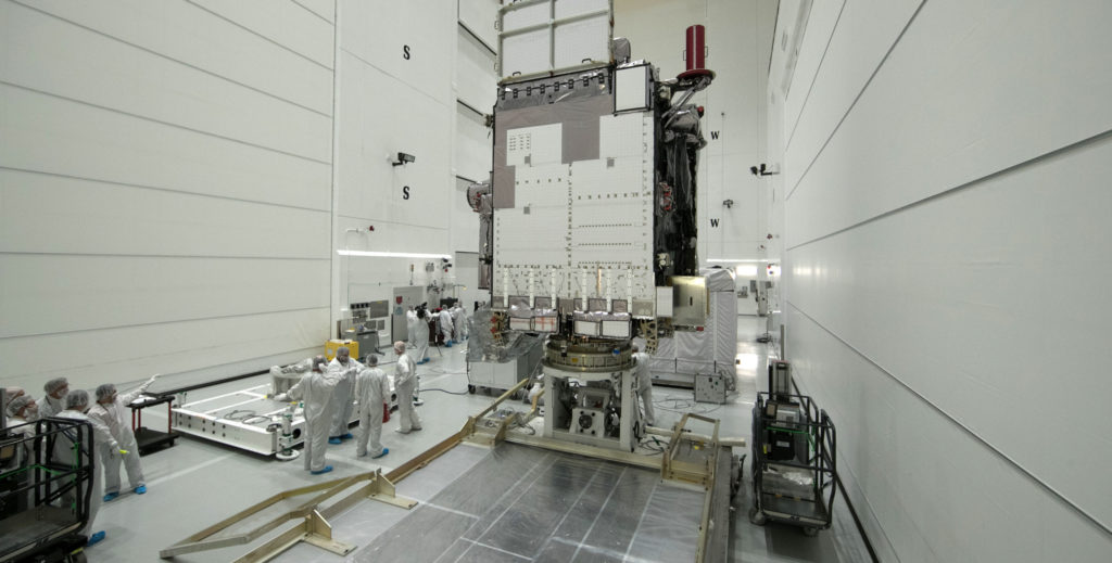 At Astrotech Space Operations in Titusville, Florida, technicians and engineers prepare to begin preflight processing of NOAA's GOES-S after removal from its shipping container.