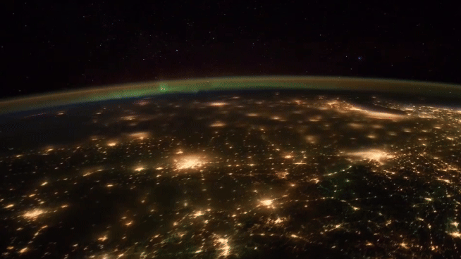 Alt Text: The bright cityscape of North America is seen from orbit with flickers of an aurora in the far distance. It transitions to an empty background with text stating “There’s space for me at NASA. Happy #NationalInternDay” with an animated red, white, and blue NASA meatball logo below the text. Credit: NASA/Greg Lee