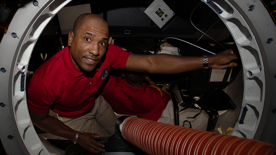 SpaceX Crew-1 Pilot and Expedition 64 Flight Engineer Victor Glover is pictured inside the Crew Dragon vehicle.