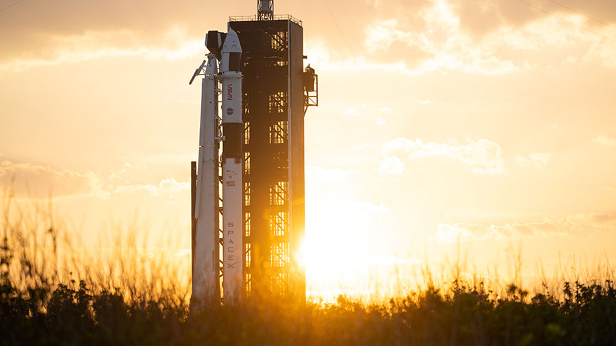 The SpaceX Falcon 9 rocket with the Crew Dragon Endeavour atop is pictured during a sunset at NASA's Kennedy Space Center in Florida. Credit: NASA/Joel Kowsky