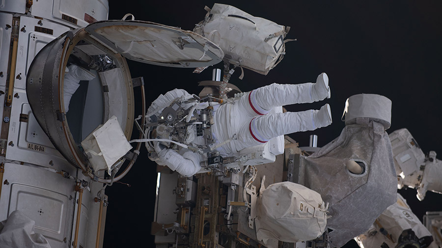 Astronaut Stephen Bowen is pictured exiting the space station's Quest airlock and beginning a spacewalk on April 28, 2023.