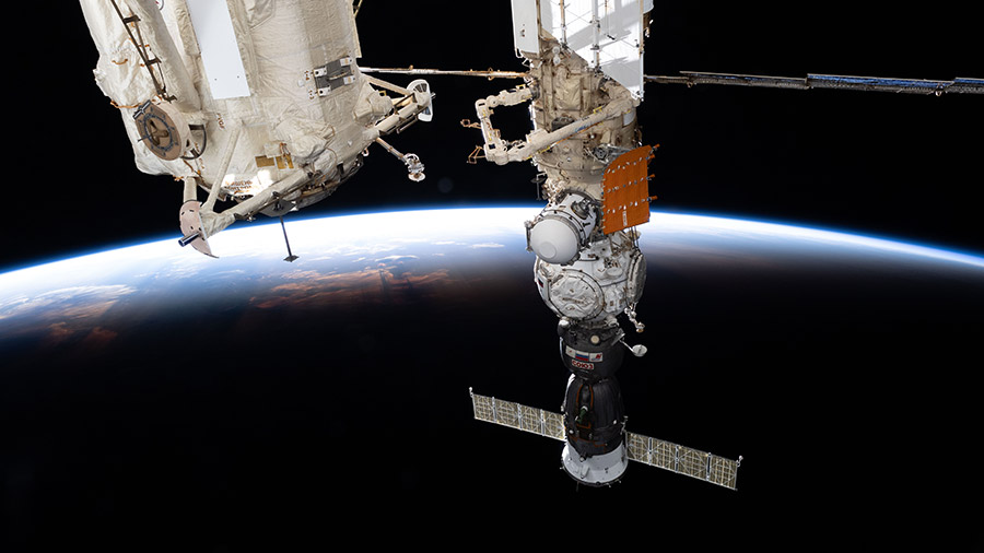 The Soyuz MS-25 crew ship is pictured docked to the Prichal docking module as the space station soared into an orbital sunset above the Indian Ocean.